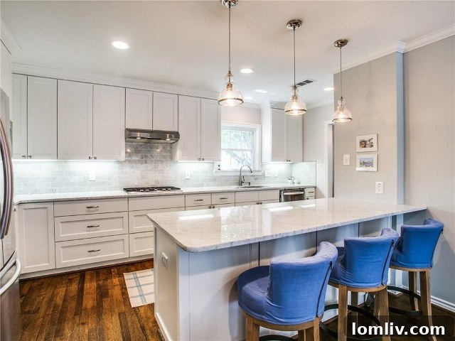 Kitchen at 4433 Hyer Street, featuring white shaker cabinets and Carrera marble countertops