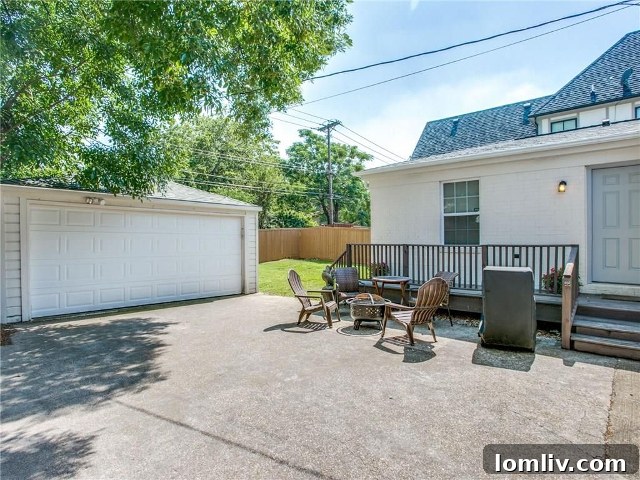 Backyard of 4433 Hyer Street with a concrete driveway and deck