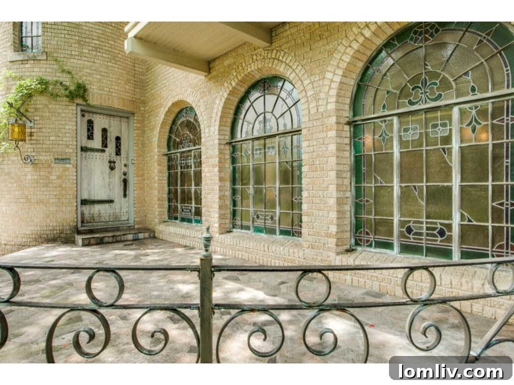 The charming porch and exterior details of 7023 Lakewood Blvd., featuring Spanish Eclectic design.