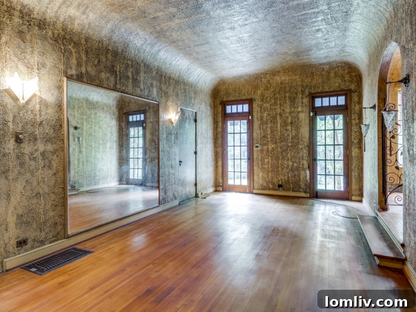 The exquisitely painted living room of 7226 Lakewood Blvd., featuring a continuous landscape mural.