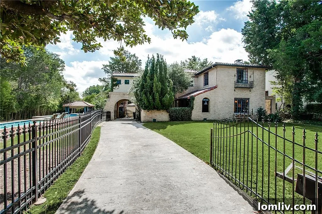 The beautifully preserved exterior of 7218 Lakewood Blvd., a 1936 Hutsell Spanish Eclectic home.