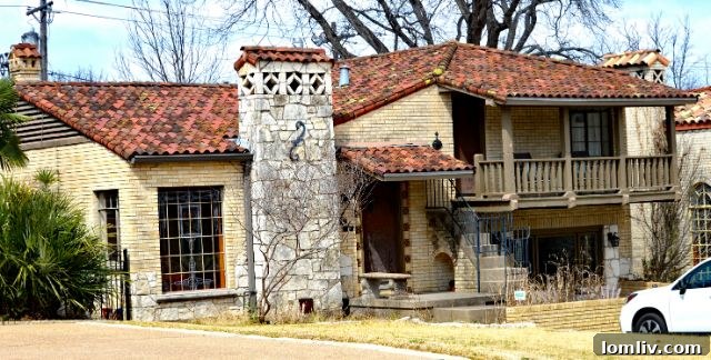 A vibrant 1936 Clifford Hutsell home at 7327 Lakewood Blvd., showcasing its classic architectural style.
