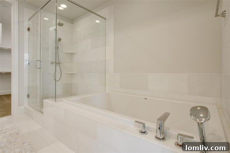 Redefining Luxury Lifestyles at Las Colinas Station 10 Elegant dual vanity in a primary bathroom with modern fixtures