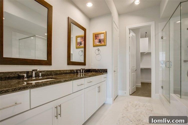 Redefining Luxury Lifestyles at Las Colinas Station 9 Luxurious primary bathroom with a freestanding tub and walk-in shower