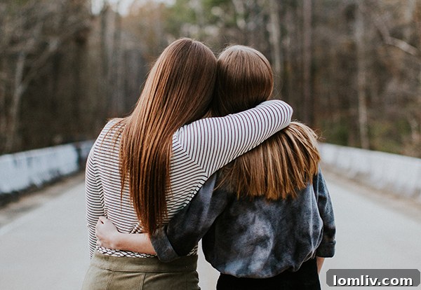 Two hands gently holding, symbolizing kindness and human connection.