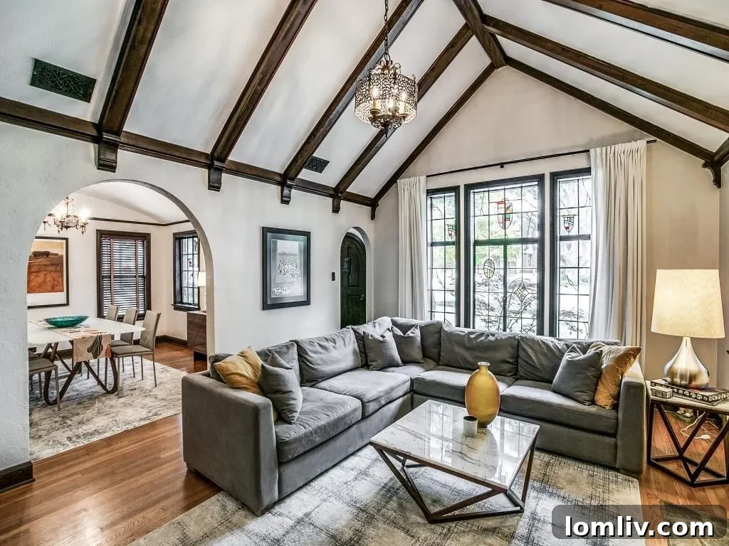 M Streets Tudor: Crafted with Care, Lived with Love 3 Elegant arched oak front door with speakeasy grill on a historic Dallas Tudor home