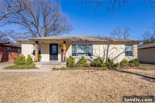 Charming Alger Park Home Exterior with Blonde Brick