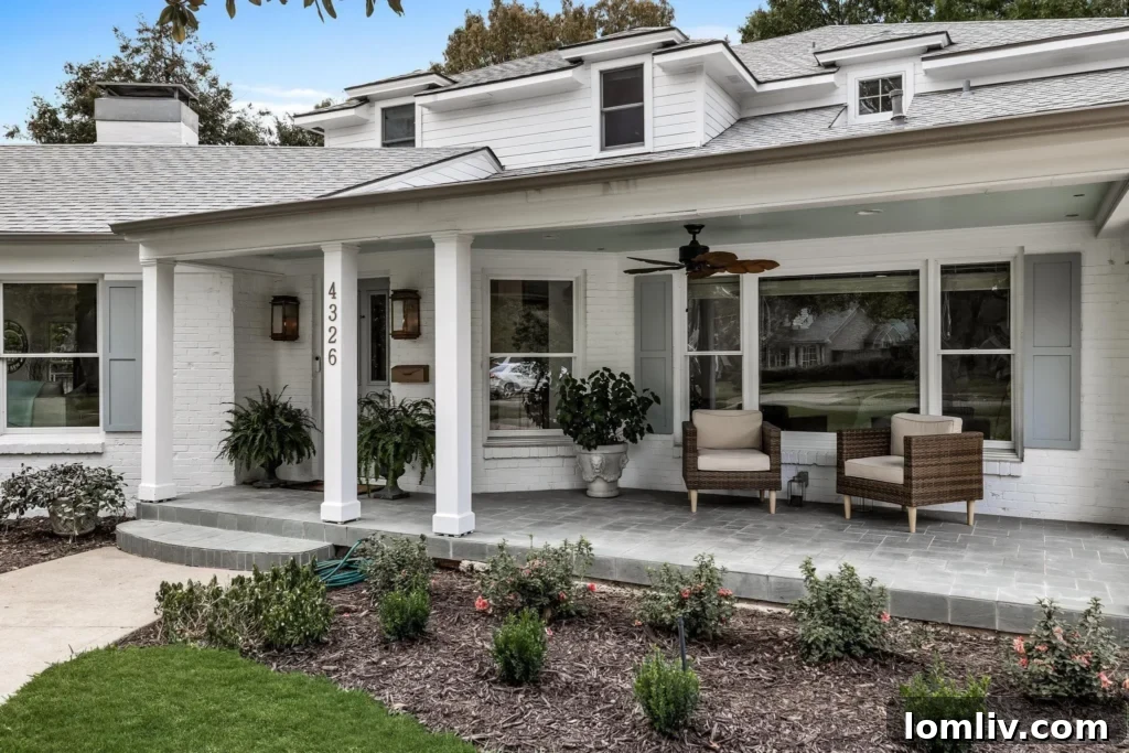 Charming Whitewashed Exterior with Covered Flagstone Patio