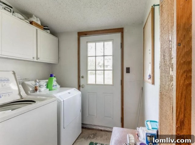 Laundry room in the Oklahoma A-frame, featuring rustic finishes.