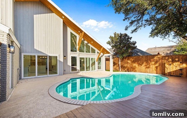 Backyard pool and patio area at 7216 Arbor Oaks Drive