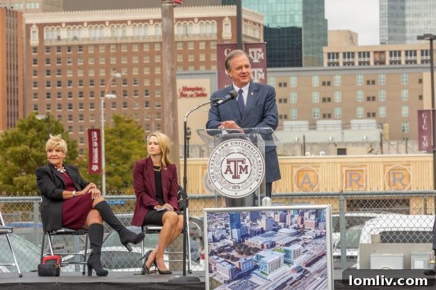 Architectural rendering of a modern, multi-story building featuring glass facades and contemporary design, representing the new Texas A&M Fort Worth campus.