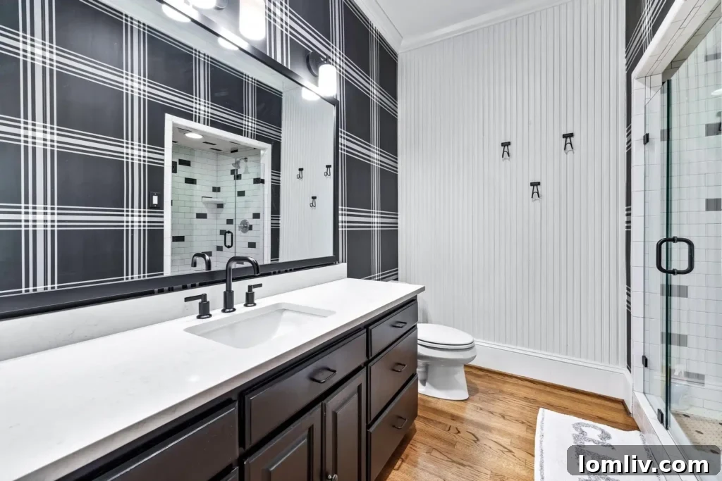 Stylish dual vanity sinks in the renovated primary bathroom
