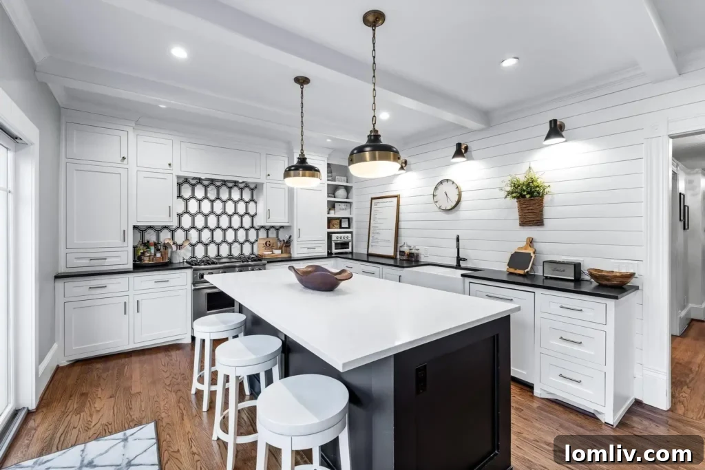 Luxuriously renovated kitchen with shiplap, granite, and Viking appliances