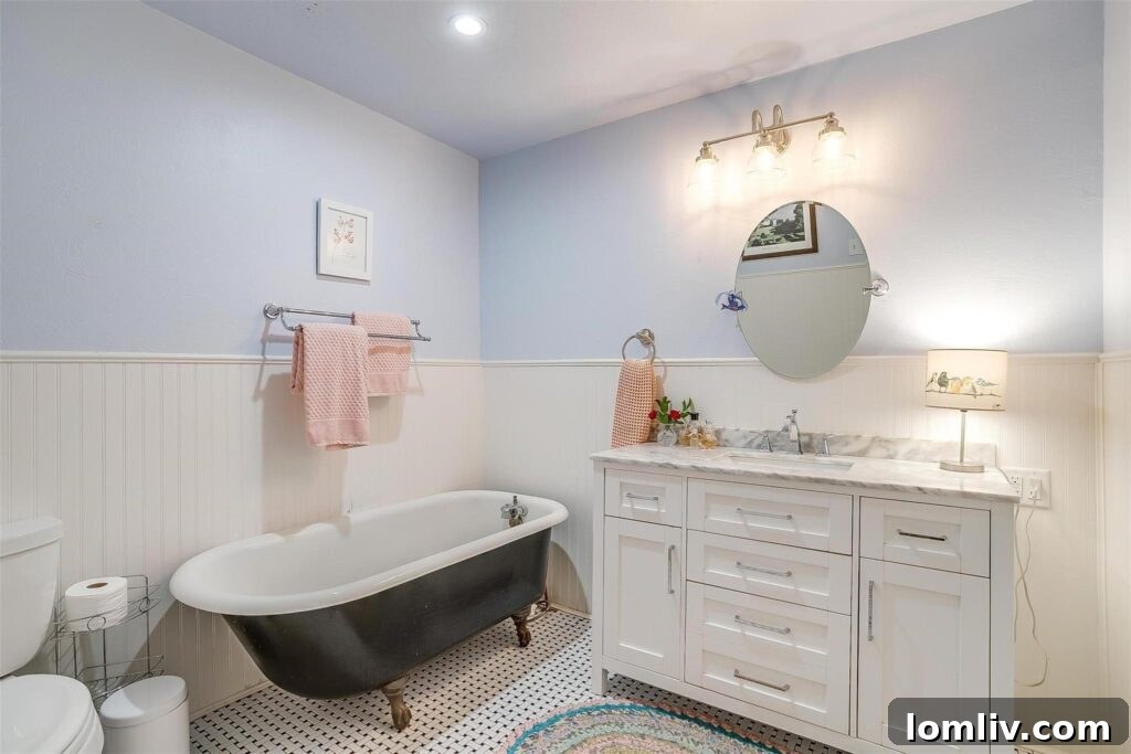 Historic Bathroom with Claw-Footed Tub and Beadboard Dado
