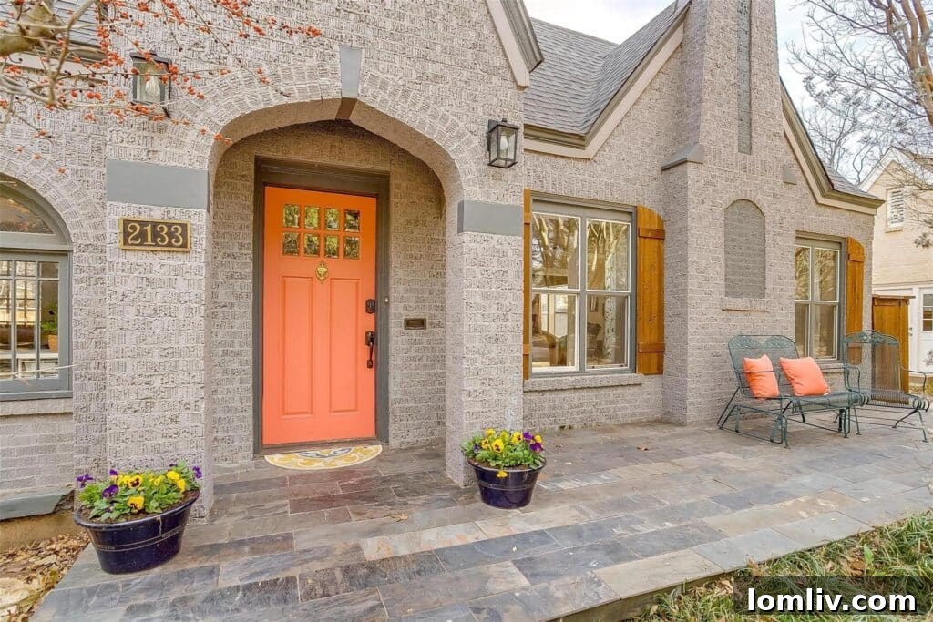 Welcoming Front Porch of Berkeley Place Home with Slate Pavers and Custom Planters
