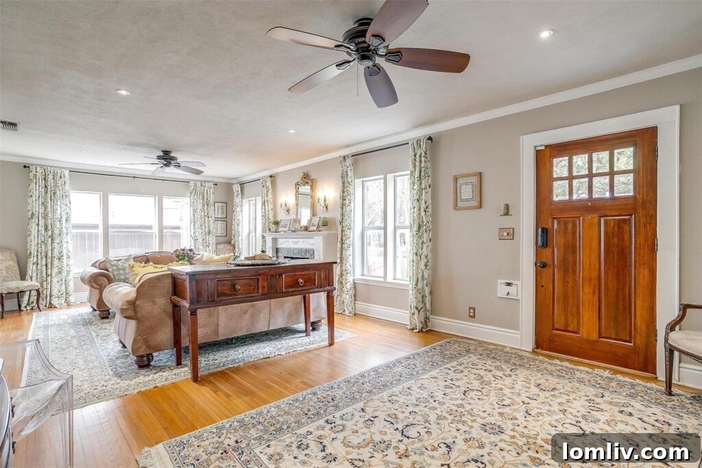 Historic Living Room Interior with Original Millwork and Fireplace in Fort Worth Tudor Bungalow