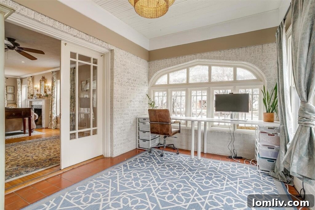 Archway Leading to Enclosed Porch Office with Natural Light