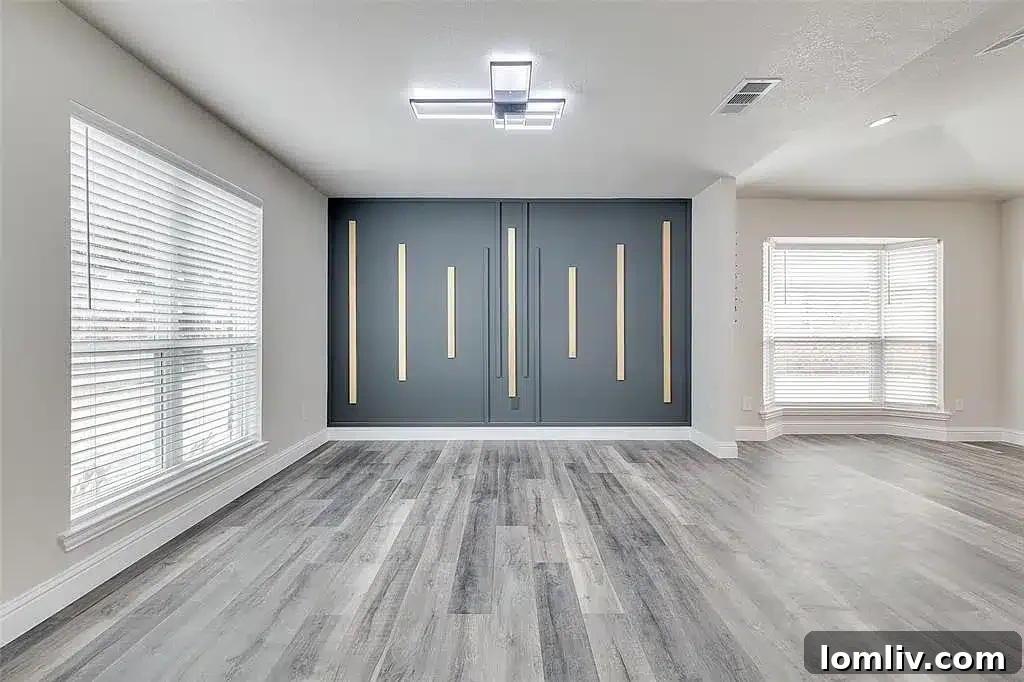 A luxurious master bathroom in the Plano home, featuring a soaking tub and separate shower.