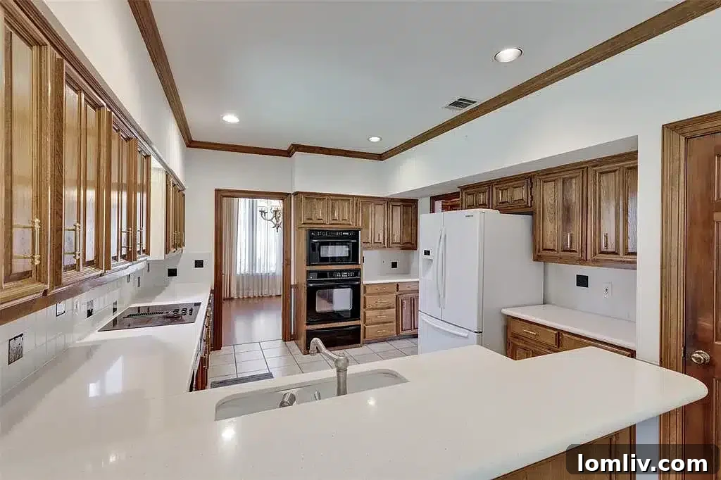 A modern kitchen in the Plano home, with sleek countertops and stainless steel appliances.