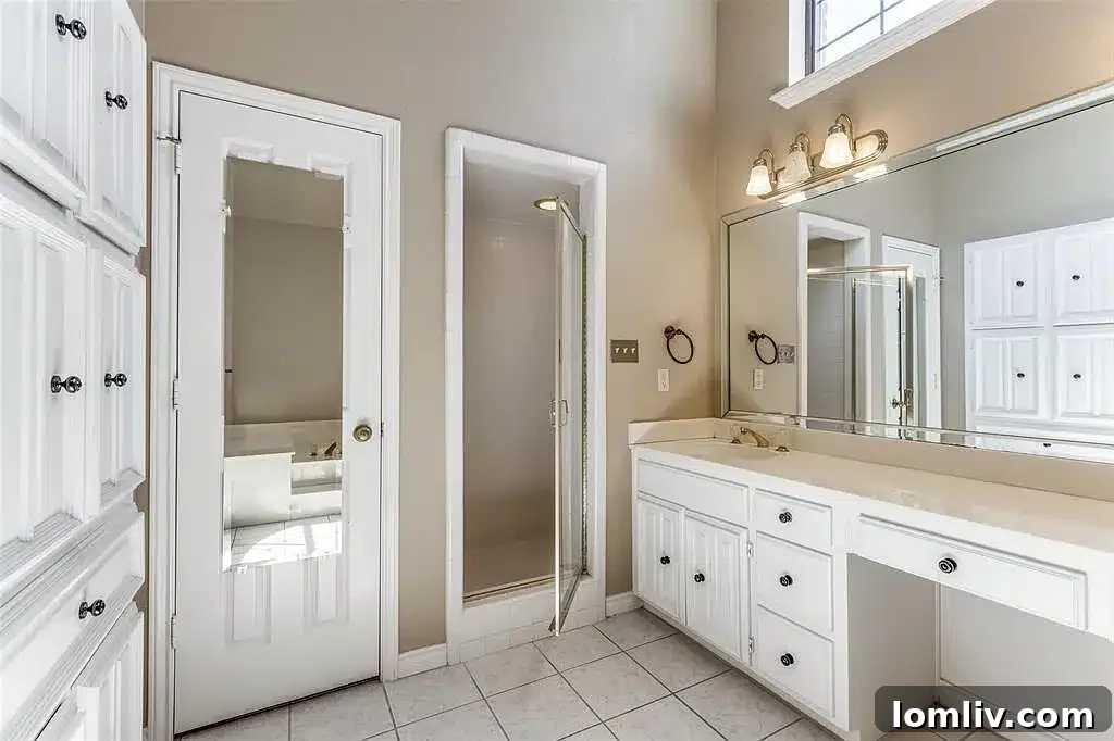 A well-appointed bathroom in the Plano home, showcasing modern fixtures and finishes.