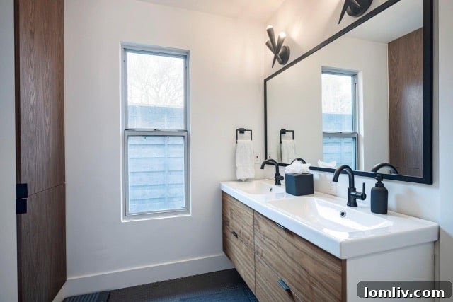 Primary bathroom with subway tile and wood cabinets