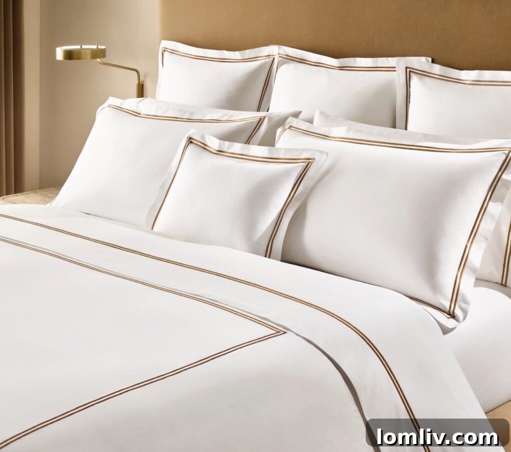 Master linen maker Carlo Bertelli’s new collection for RH is embellished with double rows of satin stitching for a classic hotel finish.