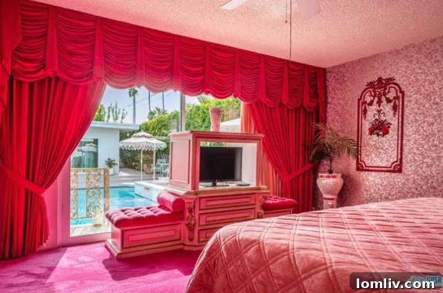 Intensely red living space with modern furniture and hot pink carpet accent