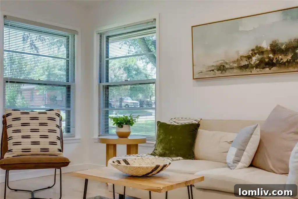 A bright and airy view from the living area towards the dining space, highlighting the open concept design and the seamless flow between rooms, ideal for both daily living and entertaining.