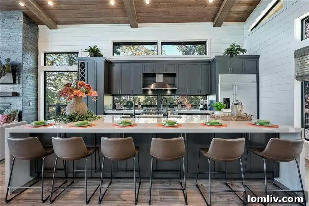 Dining area seamlessly connected to the kitchen and great room, overlooking nature