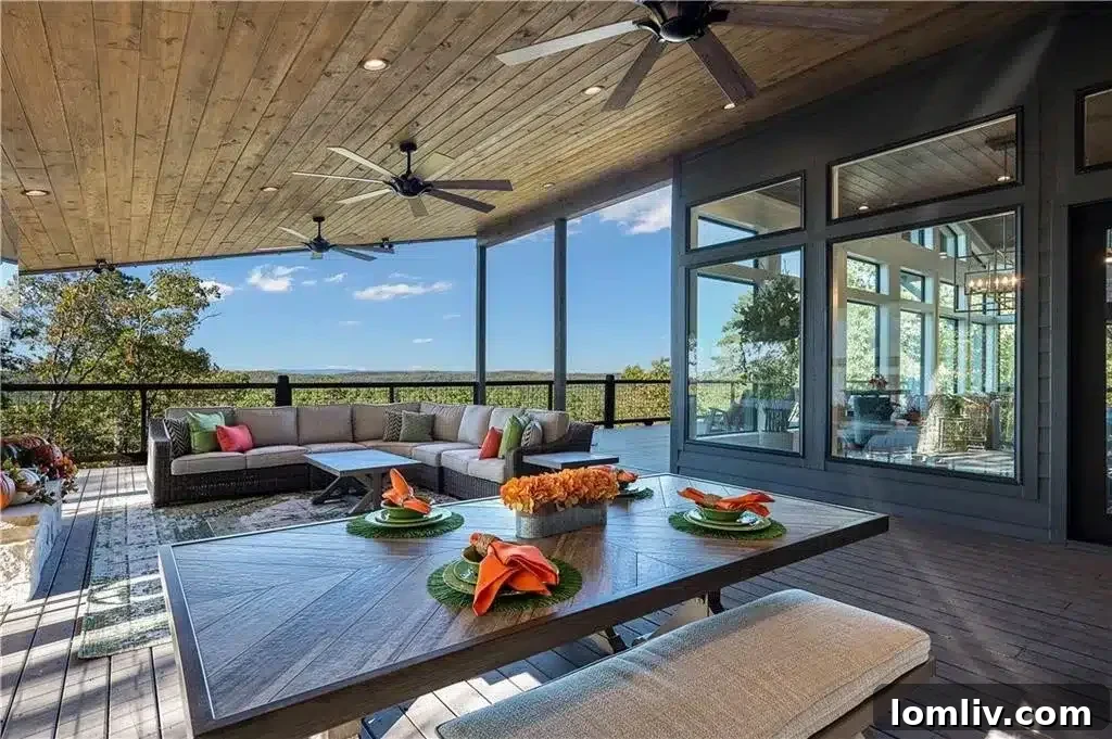 Expansive covered outdoor patio with a fireplace and stunning views