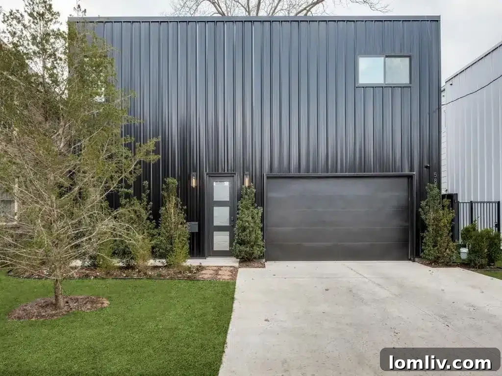 Modern home with dark facade at 5850 La Vista Drive in Dallas
