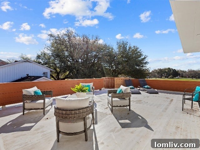 Second-level deck with fireplace offering beautiful views