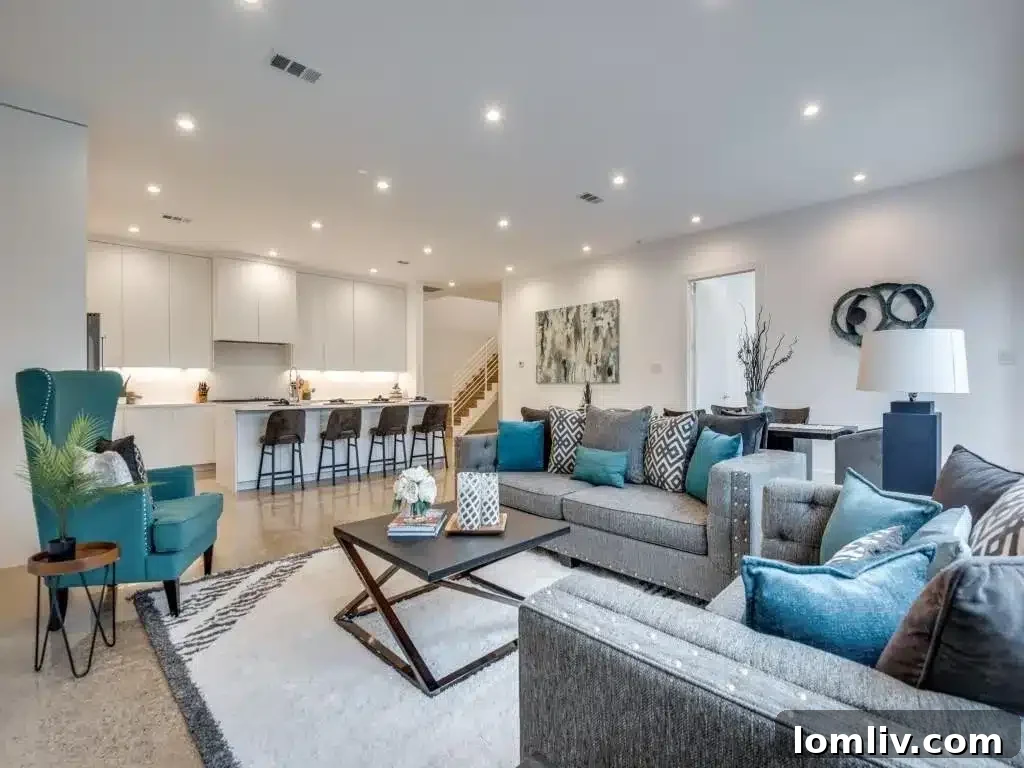 Open concept living area flowing into the contemporary kitchen at 5850 La Vista Drive