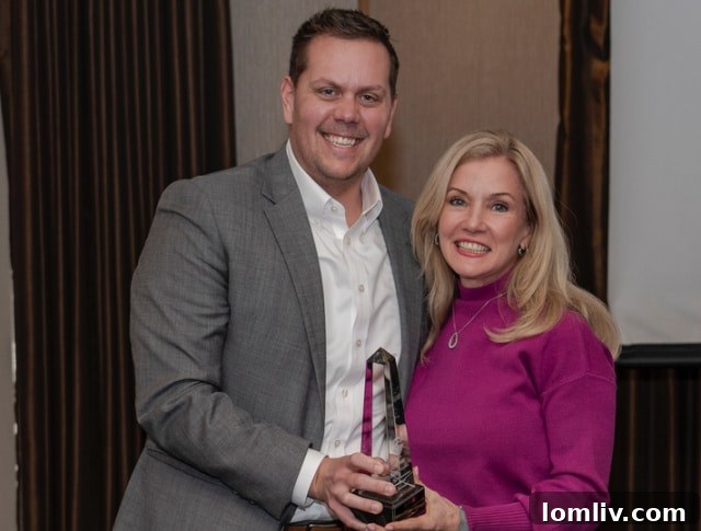 Laura Barnett with Coppell-Las Colinas Office Manager Bryan Cox