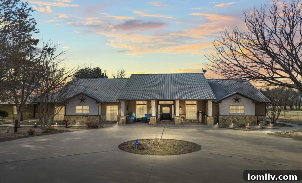 Spacious ranch home with circular driveway and stone exterior