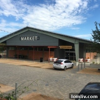 Cox Farms Market at Sylvan Thirty, an outdoor market offering fresh produce.