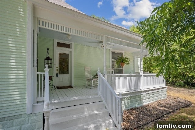 A spacious and inviting front porch of a historic Grandview home, perfect for welcoming guests and enjoying the community.