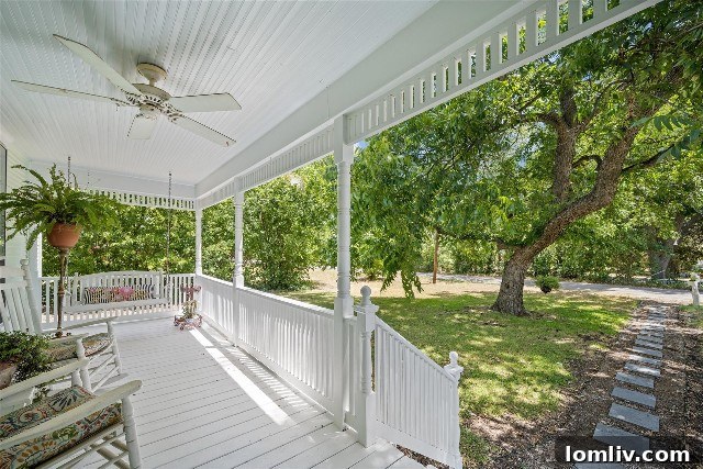 An elaborate and spacious front porch, rich with history and stories from over a century of gatherings.