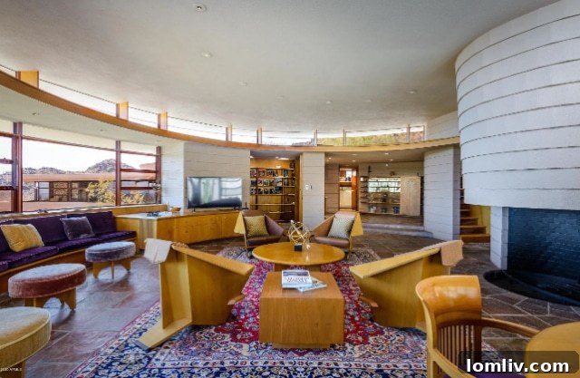 Modern kitchen with streamlined design and ample natural light, fitting perfectly into the home's circular architecture