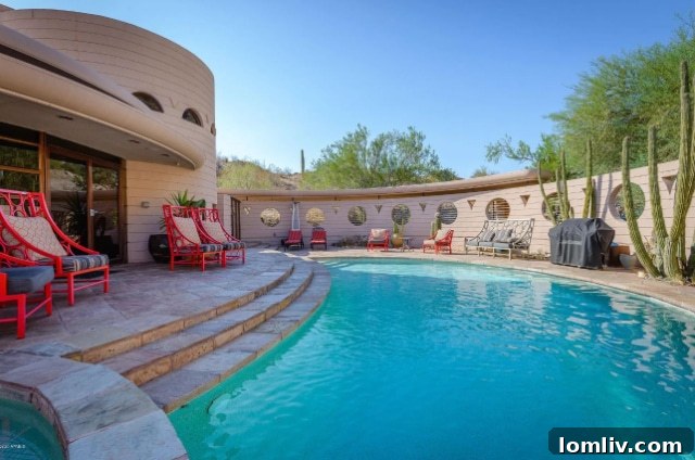 Stunning exterior view of the Circular Sun House by Frank Lloyd Wright, showcasing its iconic curvilinear design and desert integration