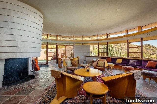 Interior view of a gracefully curved living space in the Frank Lloyd Wright-designed home, emphasizing spatial flow