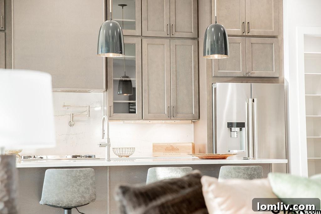 Gourmet kitchen with an oversized Mont Lucia quartzite island and professional Jennair appliances
