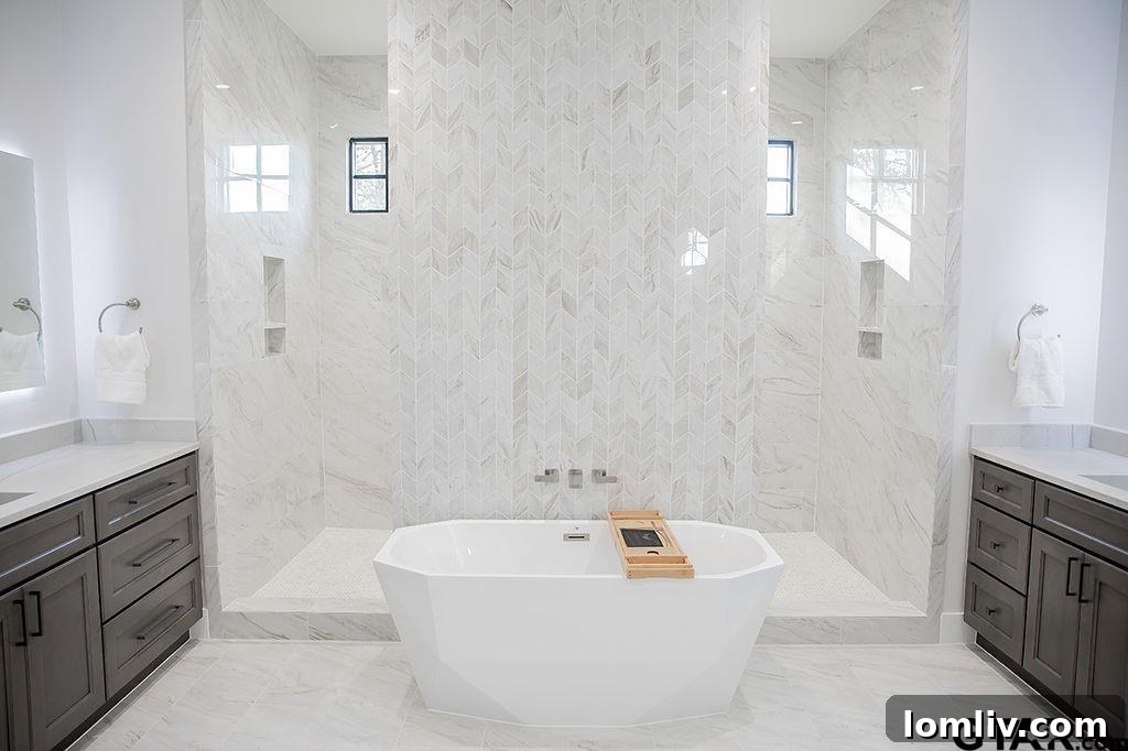 Luxurious primary bathroom featuring an immense wet room with a designer soaking tub and immaculate tilework