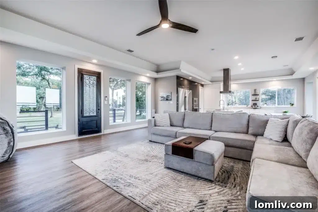 Bright open living room with lake views and modern fireplace