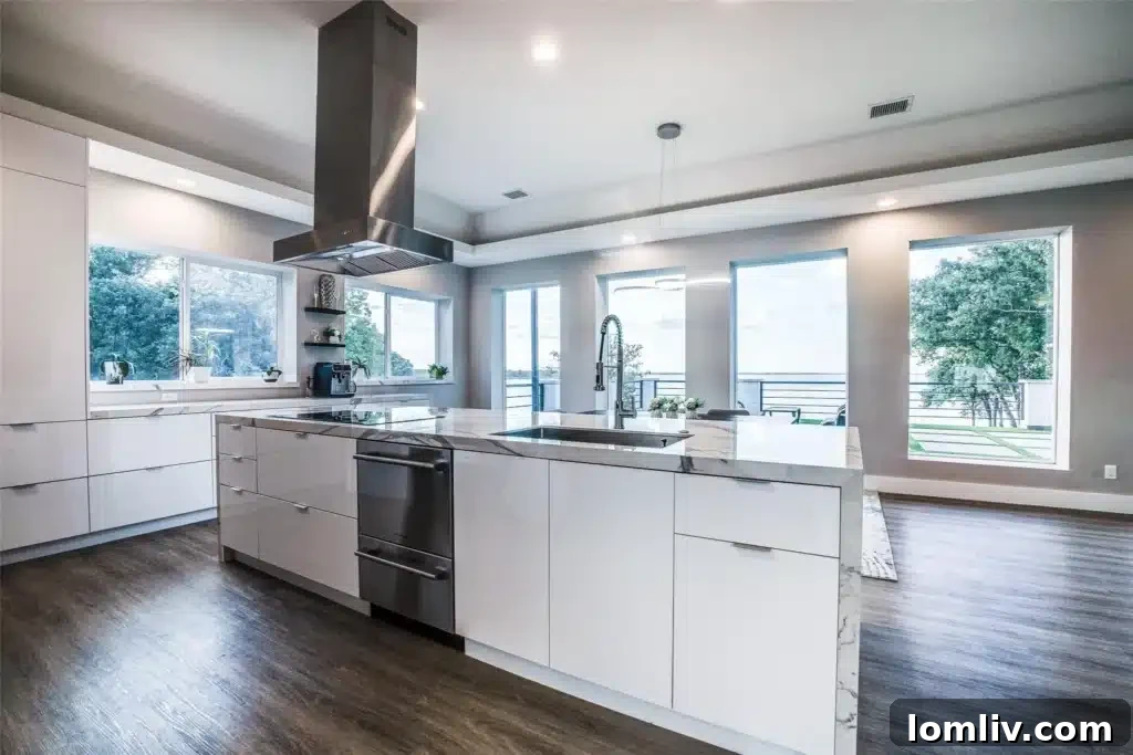 Modern kitchen with white cabinetry and marble-style porcelain