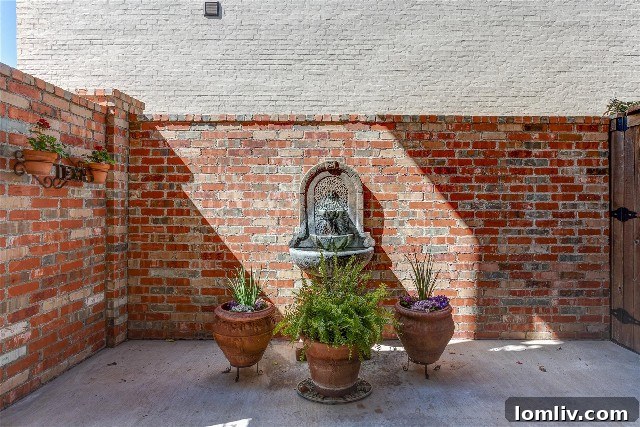 Welcoming entry courtyard fountain at 4736 Dexter