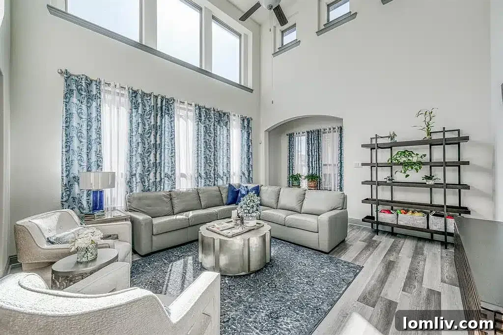 Living room with soaring ceilings and abundant natural light in an Arlington home