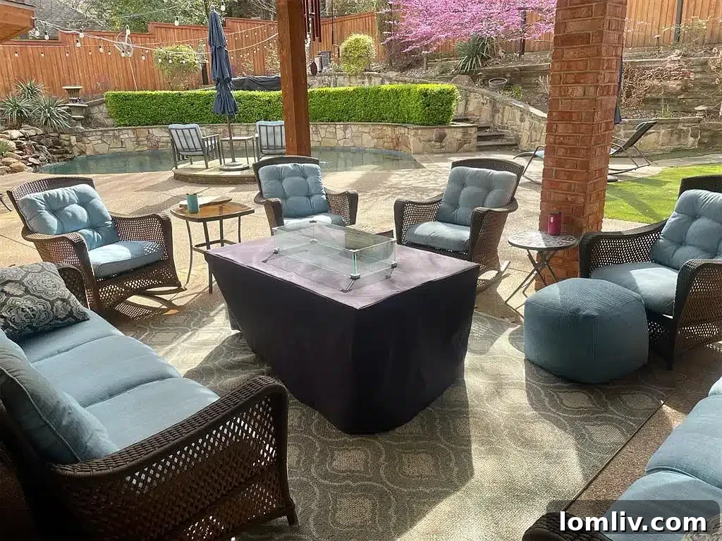 Luxurious backyard patio with comfortable seating and lush landscaping in Grapevine