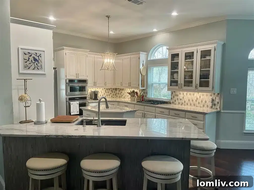 Modern kitchen with new stainless steel appliances and quartzite countertops