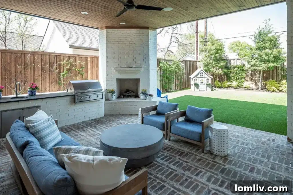 Outdoor living space in Dallas with a fireplace, grill, and room for seating